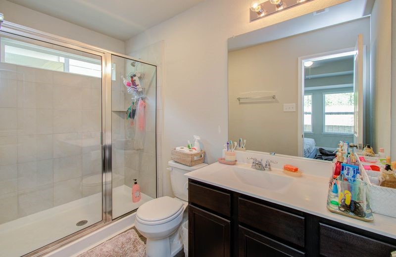 25416 Grotto Falls Lane Porter, TX 77365 - Photo 10 of 15 a bathroom with a sink a toilet and shower