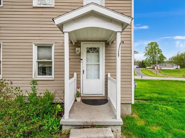 a front view of a house with garden