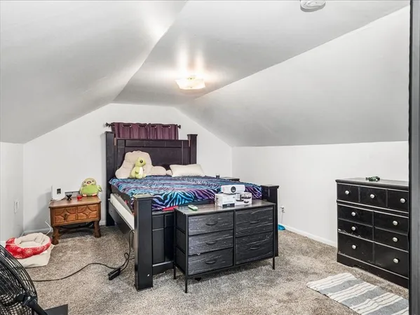 a bedroom with a bed and furniture