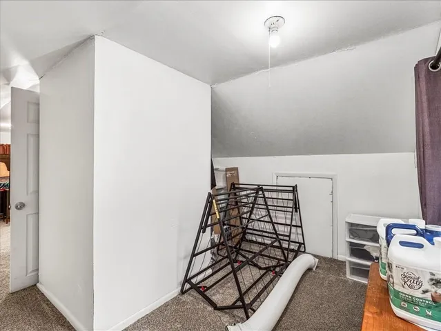 a view of a bedroom with bed and closet