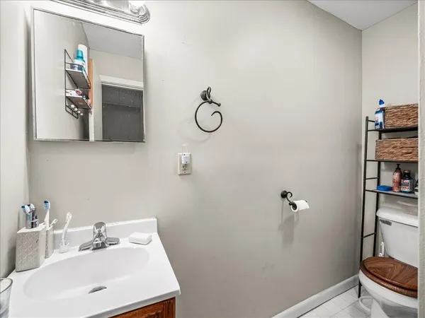 a bathroom with a toilet and a sink