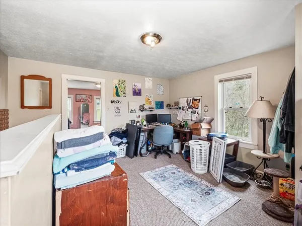 a living room with lots of furniture and a window