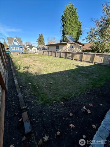 a view of a pathway with a garden