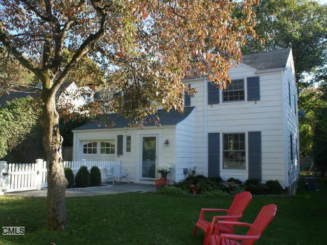 20 Devon Road Darien, CT 06820 - Photo 1 of 1 a front view of a house with a yard