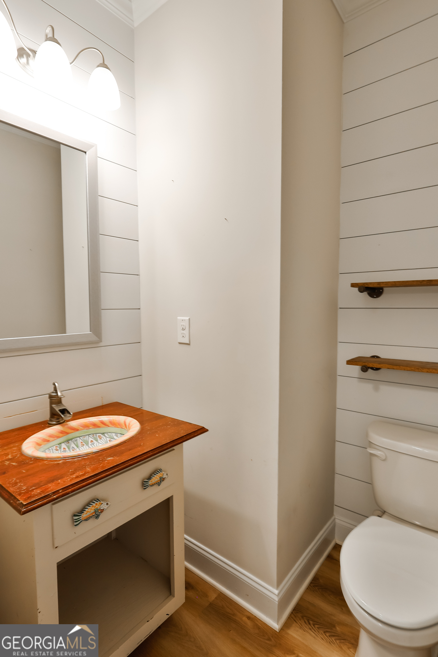 563 Wynn Road McDonough, GA 30252 - Photo 16 of 47 a bathroom with a sink and a toilet