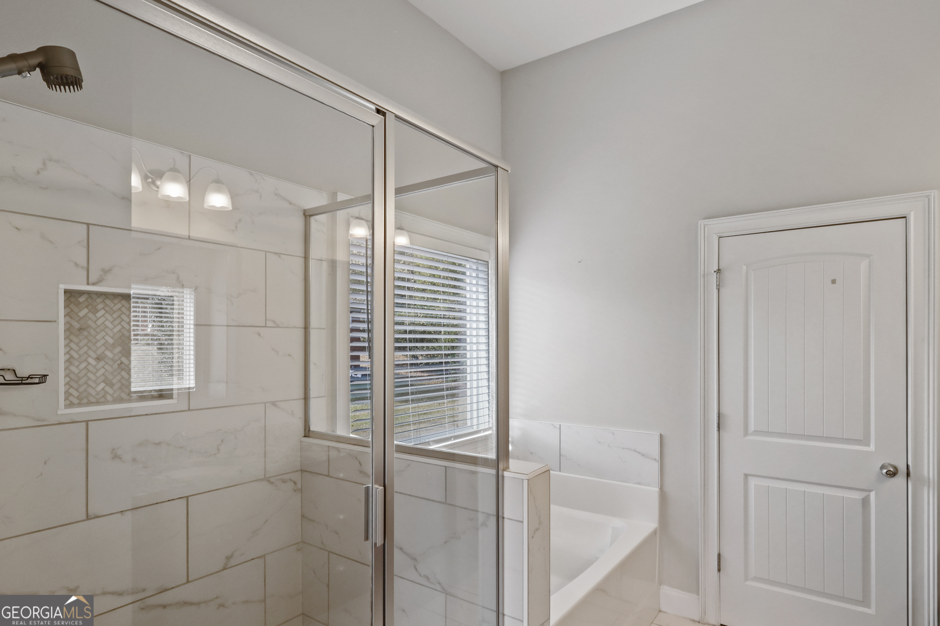 563 Wynn Road McDonough, GA 30252 - Photo 21 of 47 a bathroom with a bathtub and shower