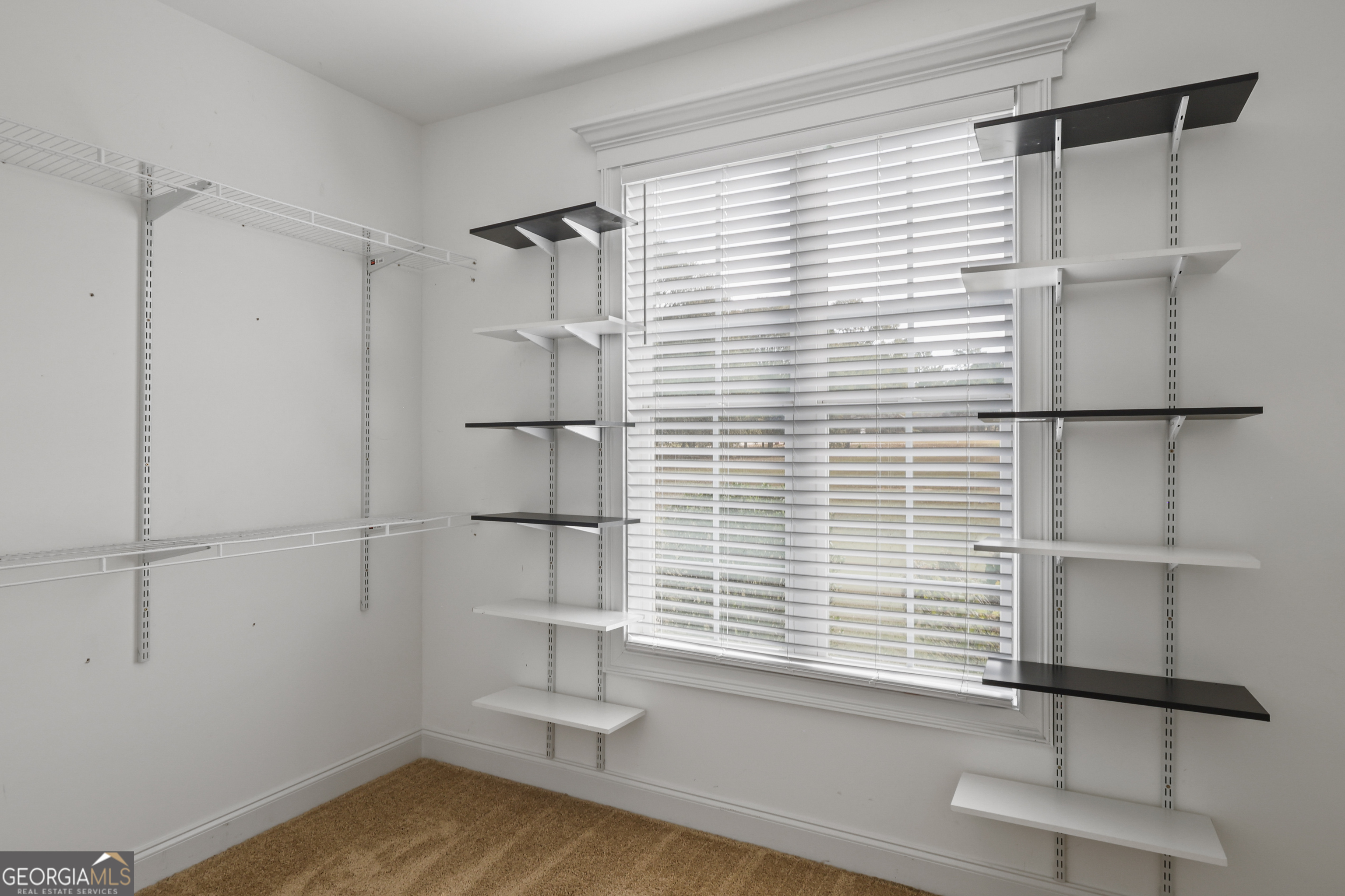 563 Wynn Road McDonough, GA 30252 - Photo 23 of 47 a view of empty room with wooden floor and fan