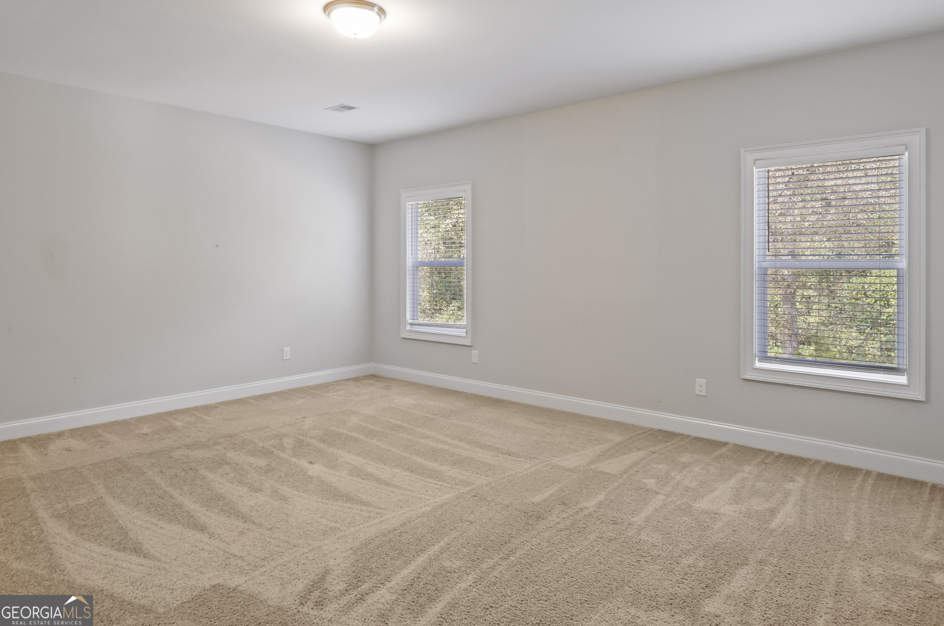 563 Wynn Road McDonough, GA 30252 - Photo 27 of 47 a view of an empty room with a window