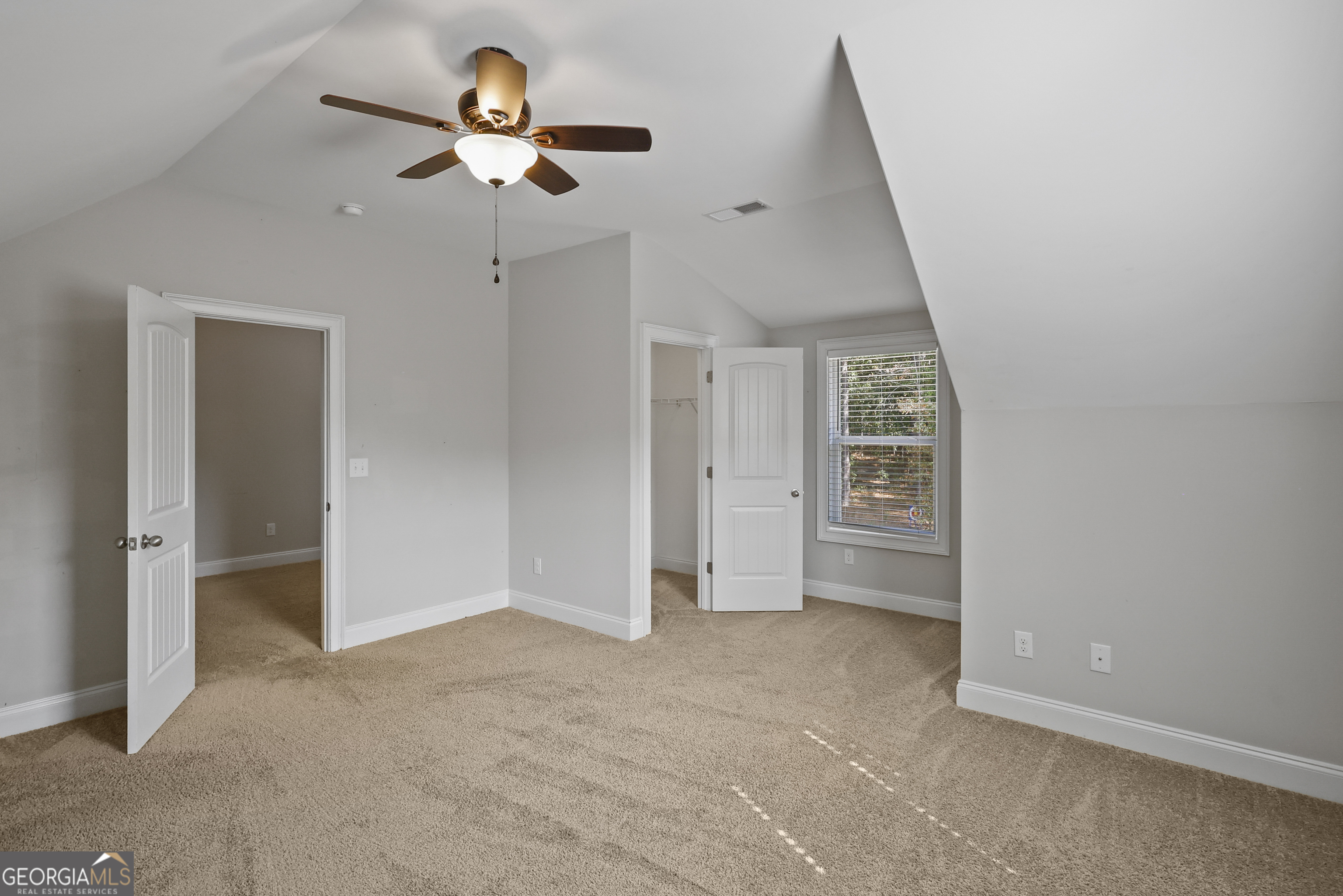 563 Wynn Road McDonough, GA 30252 - Photo 36 of 47 wooden floor in an empty room with a chandelier fan