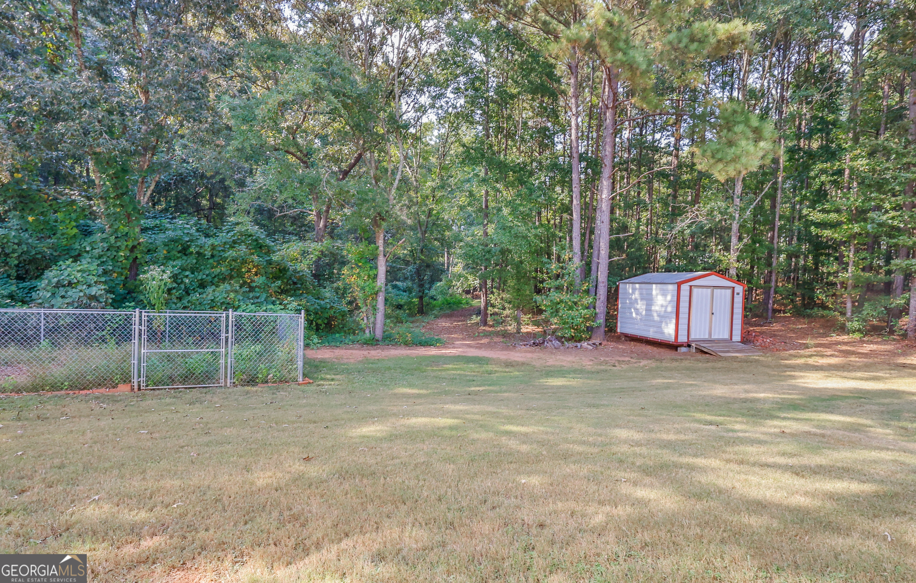 563 Wynn Road McDonough, GA 30252 - Photo 40 of 47 a backyard of a house with lots of green space