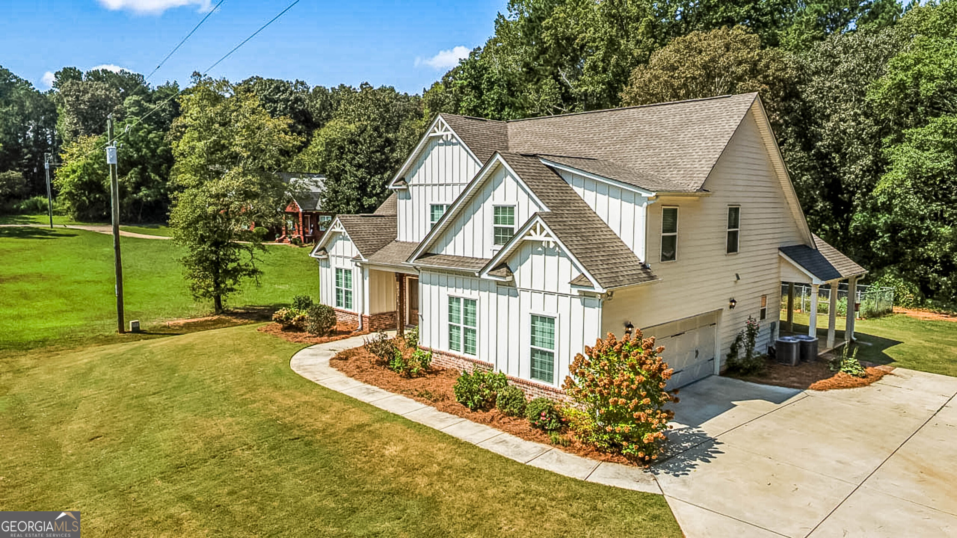 563 Wynn Road McDonough, GA 30252 - Photo 6 of 47 a front view of a house with garden