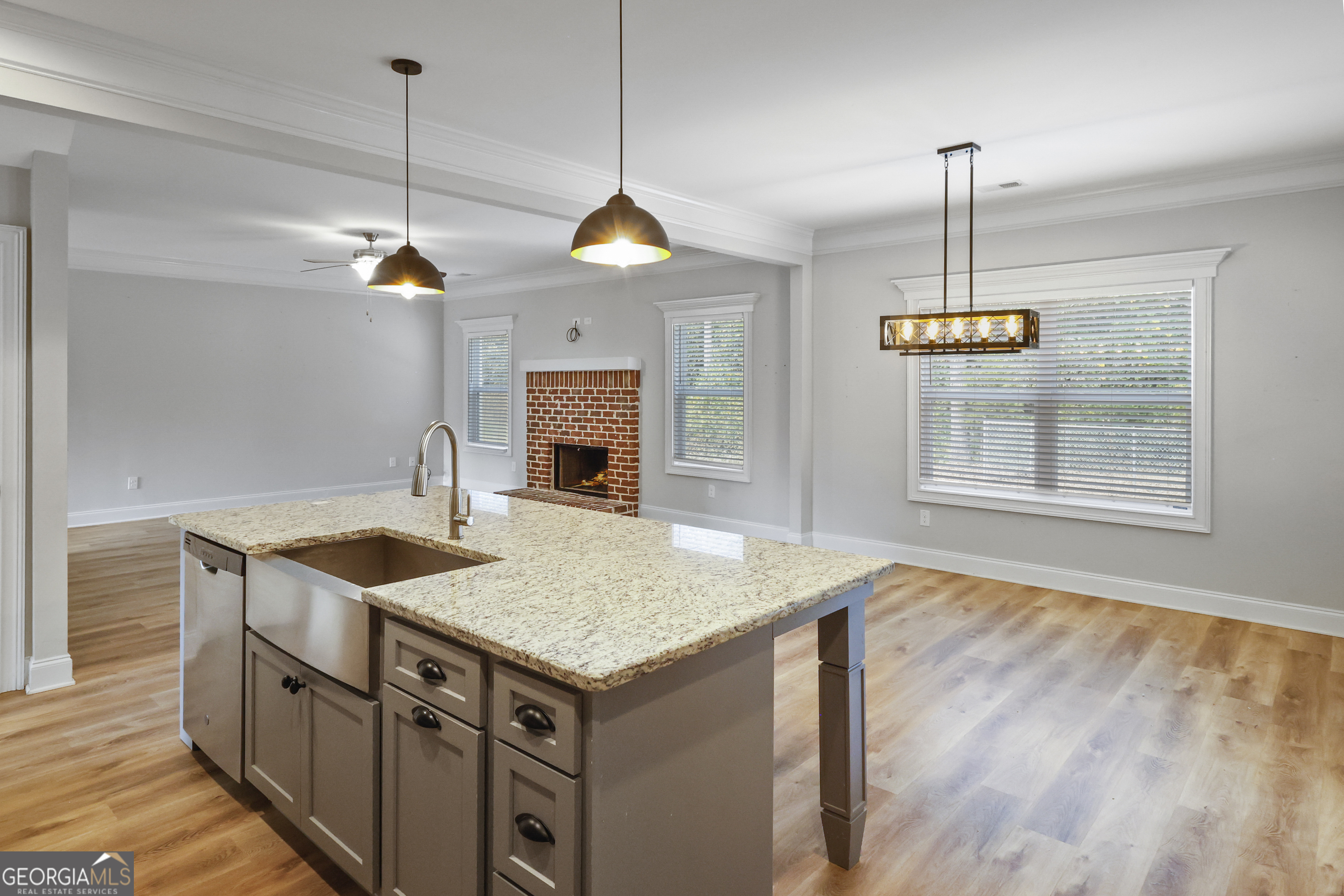 563 Wynn Road McDonough, GA 30252 - Photo 7 of 47 a kitchen with stainless steel appliances granite countertop a sink a stove and a wooden floor