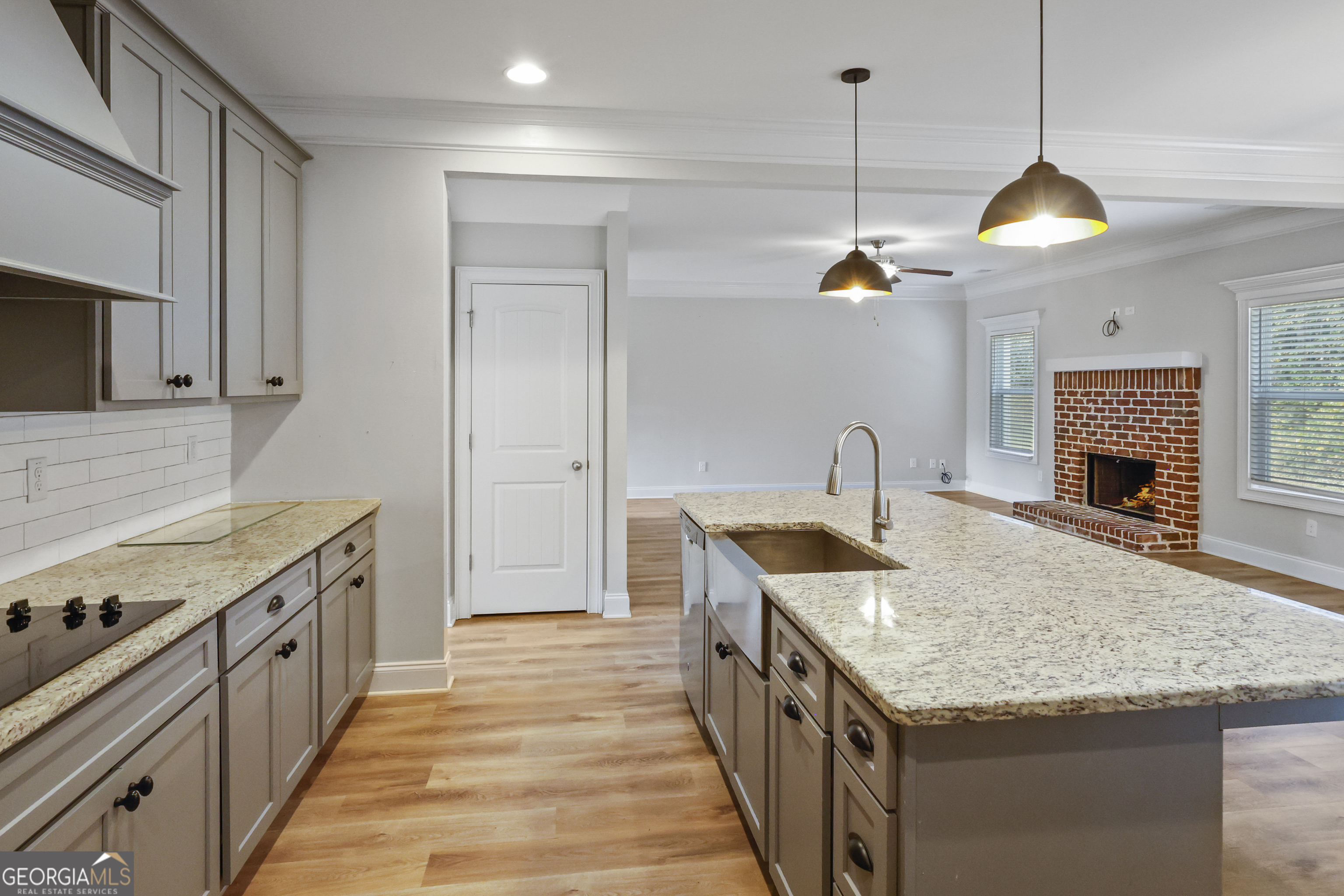 563 Wynn Road McDonough, GA 30252 - Photo 8 of 47 a kitchen with a stove and a kitchen island