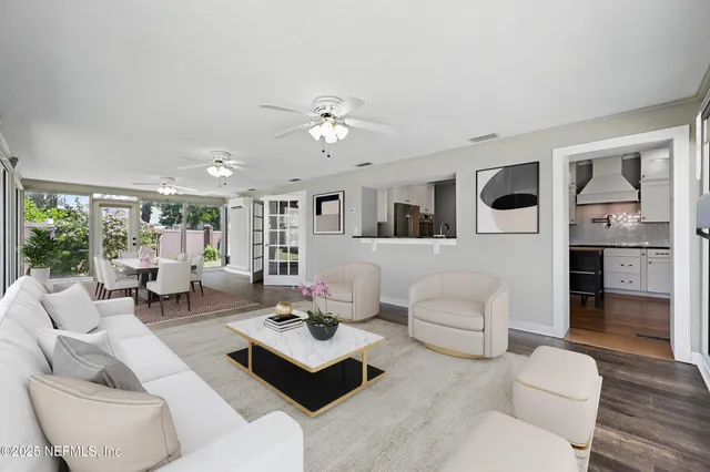 a kitchen with granite countertop stainless steel appliances a refrigerator and cabinets