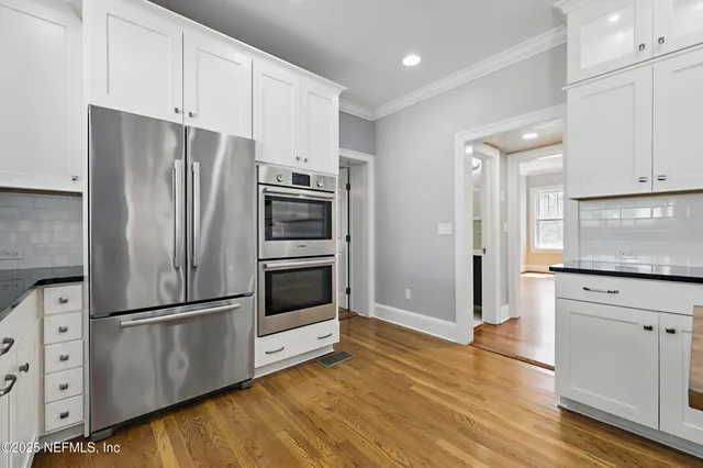 a kitchen with appliances cabinets and a counter top