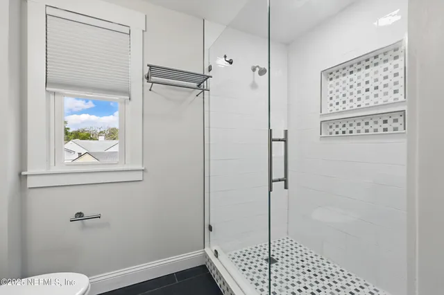 a view of a house with yard and sitting area