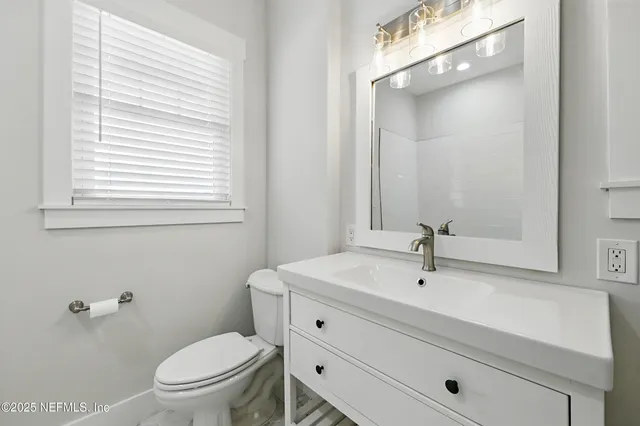 an aerial view of residential houses with yard