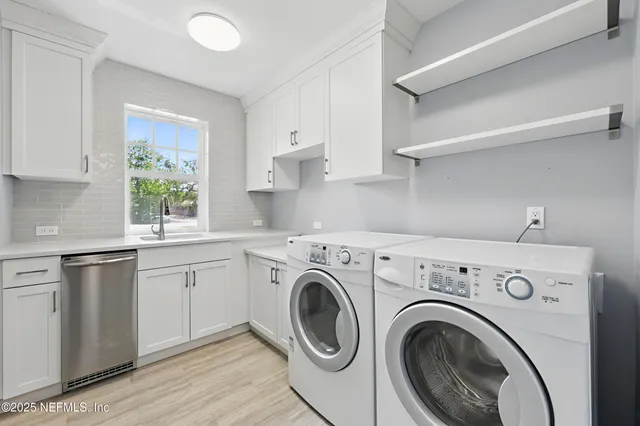 a white toilet sitting next to a bathroom sink