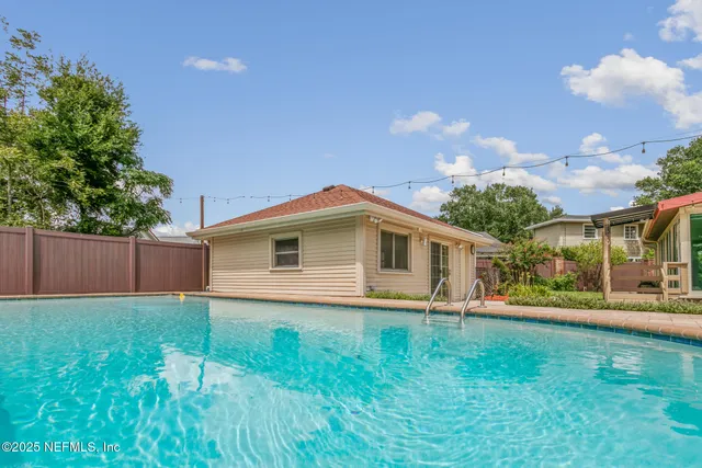a living room with fireplace furniture and a wooden floor
