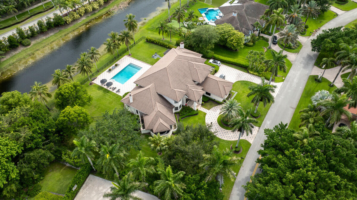 3500 Windmill Ranch Road Weston, FL 33331 - Photo 4 of 47 an aerial view of a house with a lake view