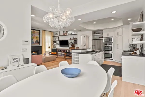 a living room with fireplace furniture and a flat screen tv