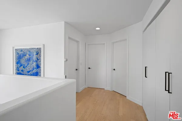 a view of a hallway with closet