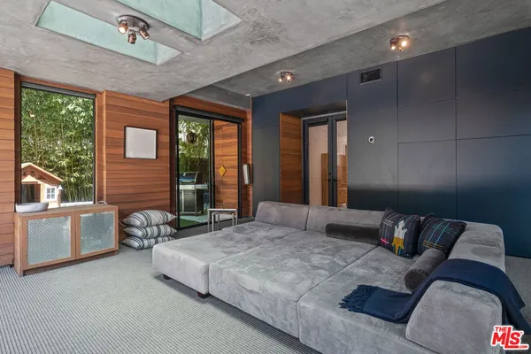 a bedroom with a large bed and balcony