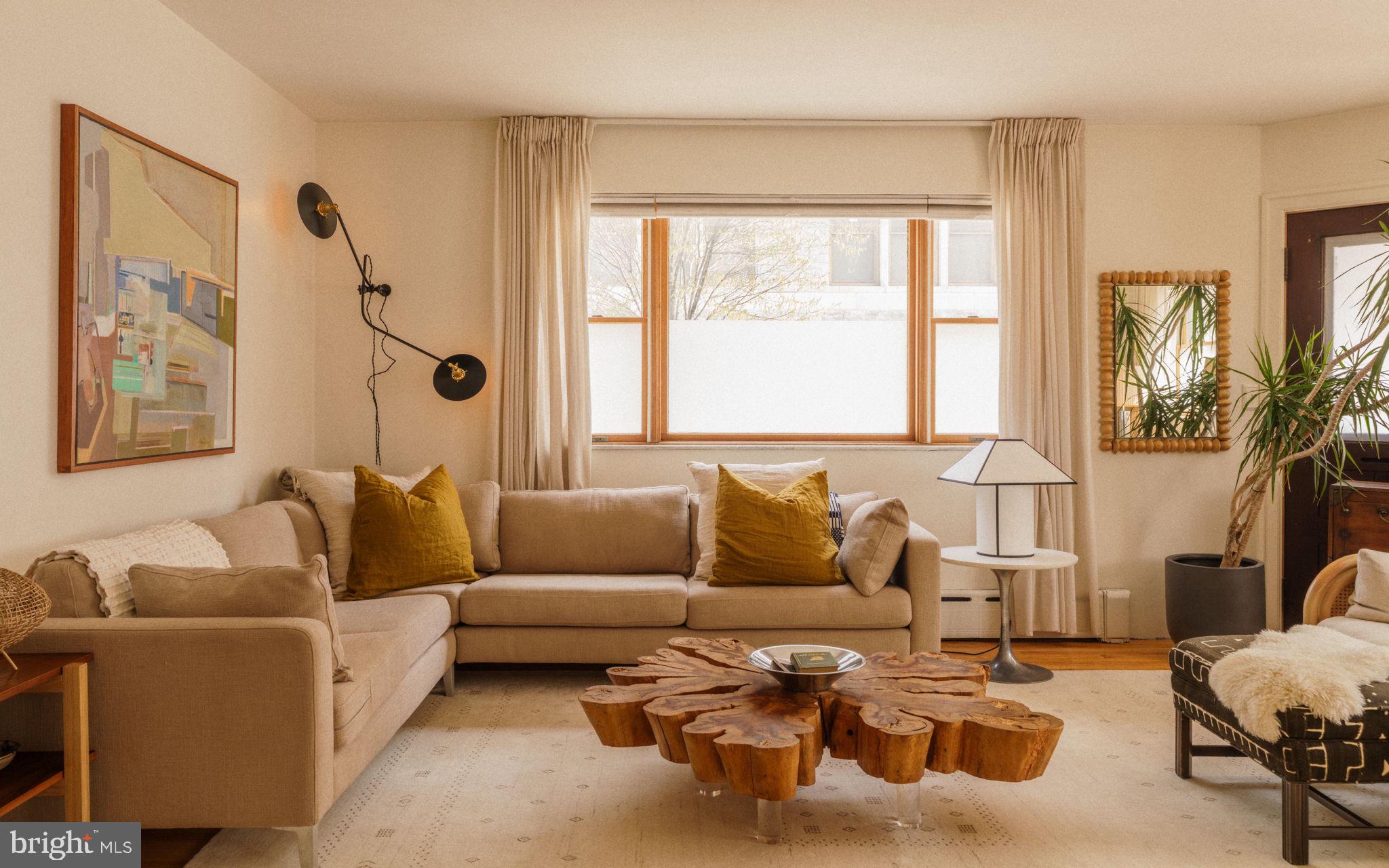 1828 South 9th Street Philadelphia, PA 19148 - Photo 13 of 83 a living room with furniture and a large window
