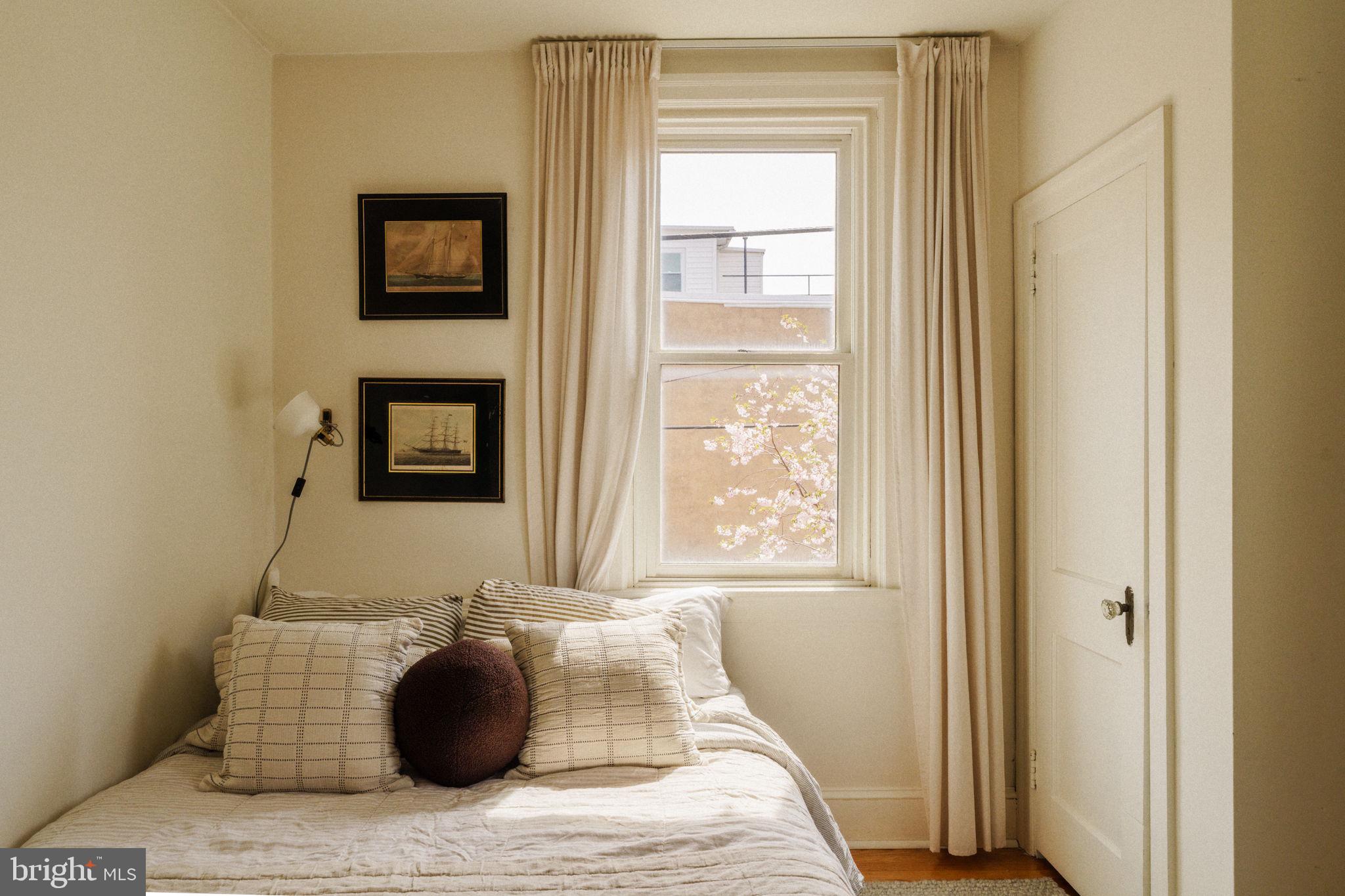1828 South 9th Street Philadelphia, PA 19148 - Photo 37 of 83 a bedroom with a bed and a window