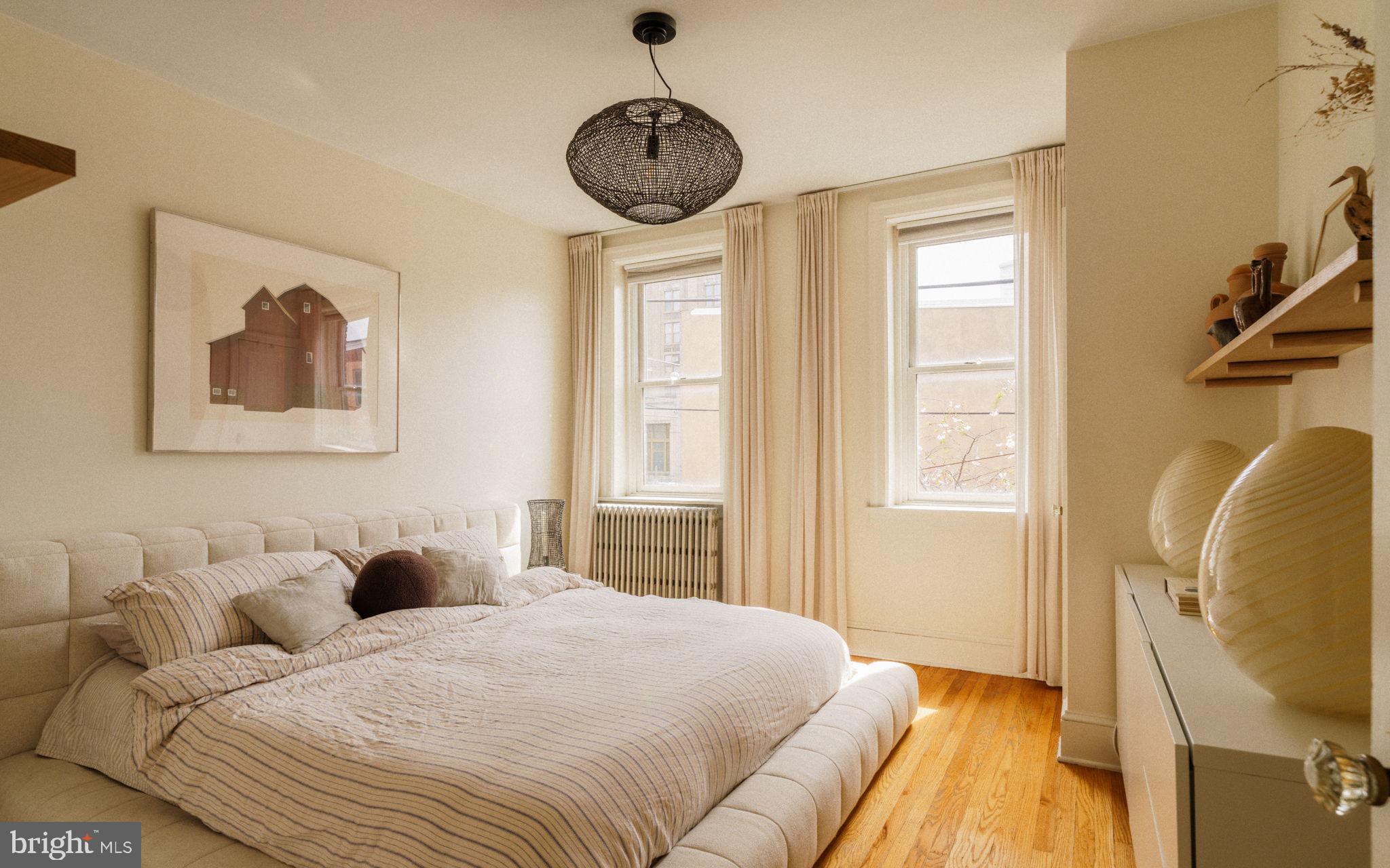 1828 South 9th Street Philadelphia, PA 19148 - Photo 40 of 83 a bedroom with bed and a window