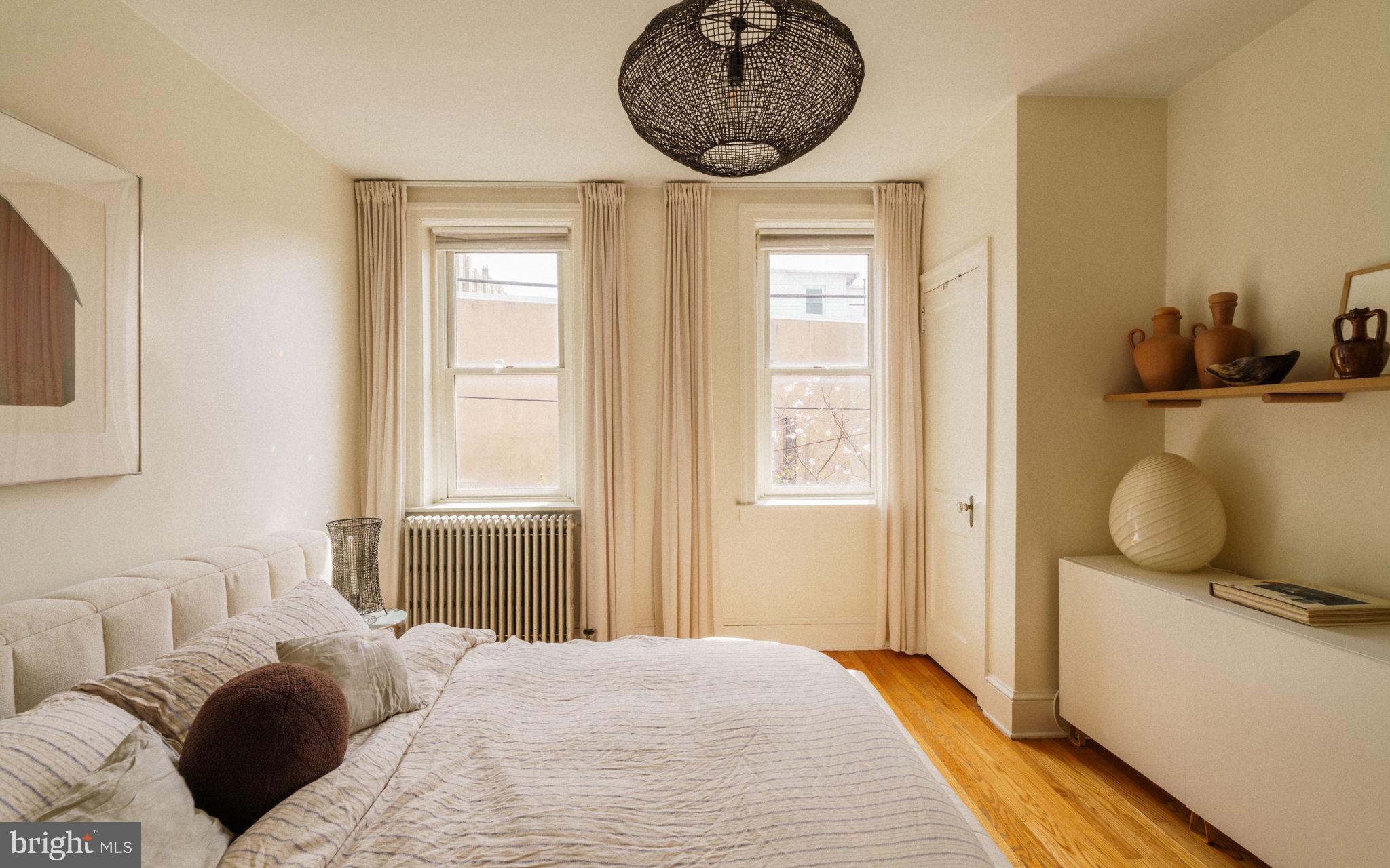 1828 South 9th Street Philadelphia, PA 19148 - Photo 42 of 83 a bedroom with a bed and a window