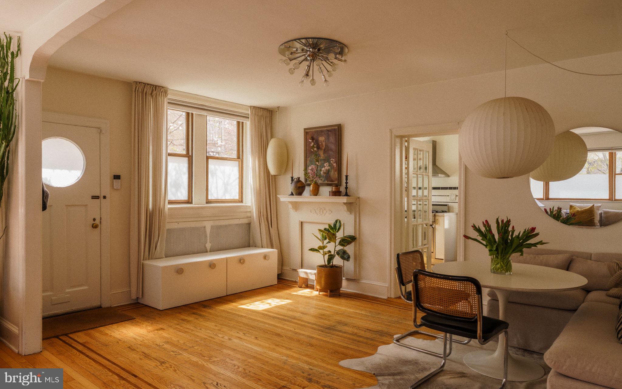 1828 South 9th Street Philadelphia, PA 19148 - Photo 5 of 83 a living room with furniture and wooden floor