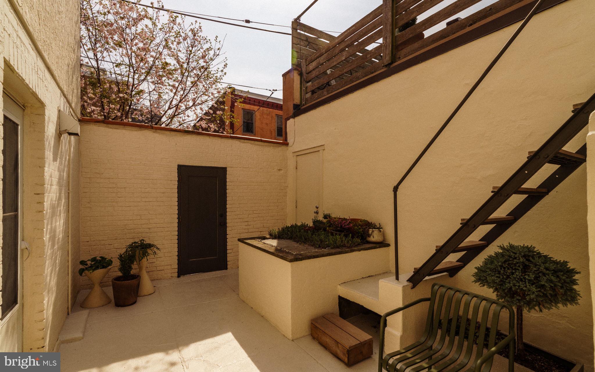 1828 South 9th Street Philadelphia, PA 19148 - Photo 52 of 83 a view of a livingroom with furniture and staircase