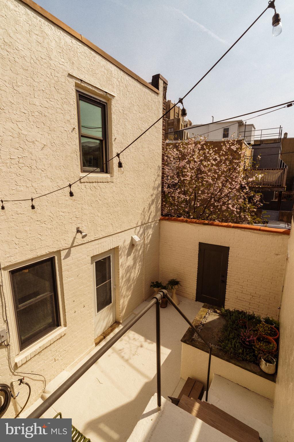 1828 South 9th Street Philadelphia, PA 19148 - Photo 54 of 83 a laptop computer sitting on top of a wooden floor