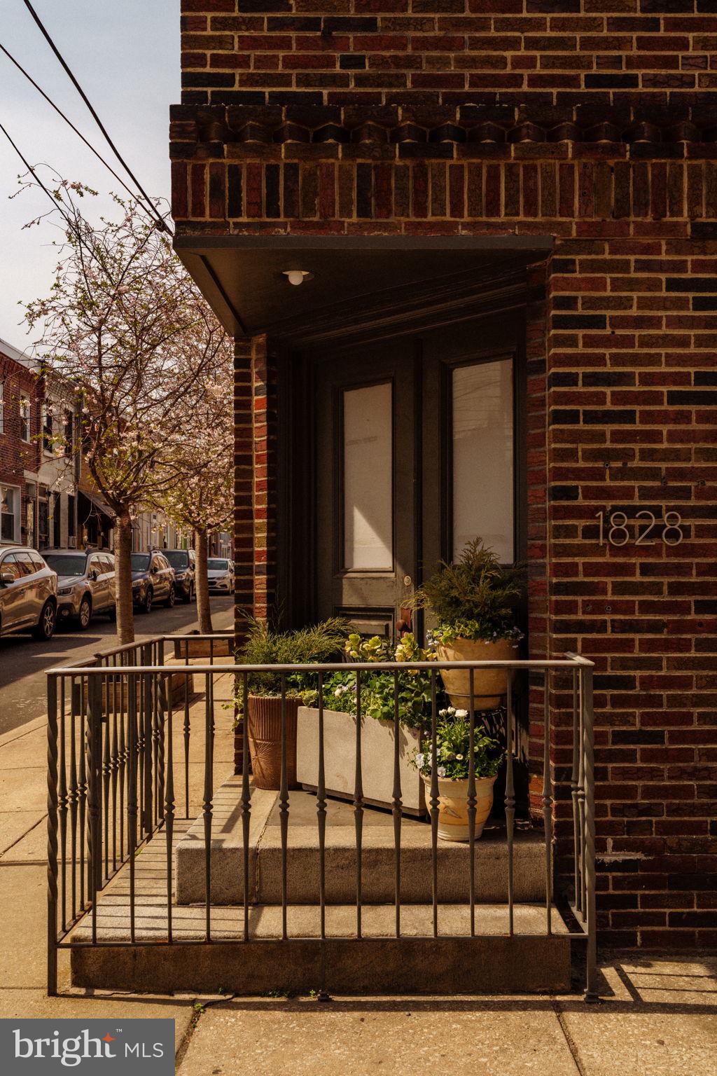 1828 South 9th Street Philadelphia, PA 19148 - Photo 68 of 83 a view of a brick house with large windows