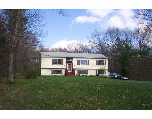 528 Cronin Road Warren, MA 01585 - Photo 1 of 13 a front view of a house with a yard