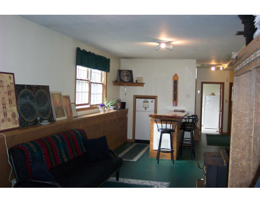 528 Cronin Road Warren, MA 01585 - Photo 13 of 13 a living room with furniture and a window