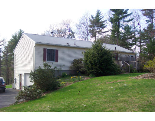 528 Cronin Road Warren, MA 01585 - Photo 2 of 13 a view of a backyard with potted plants and large trees