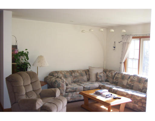528 Cronin Road Warren, MA 01585 - Photo 5 of 13 a living room with furniture and a large window