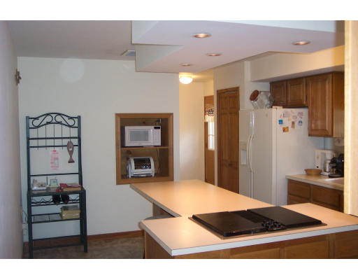 528 Cronin Road Warren, MA 01585 - Photo 6 of 13 a kitchen with stainless steel appliances kitchen island granite countertop a refrigerator and a sink