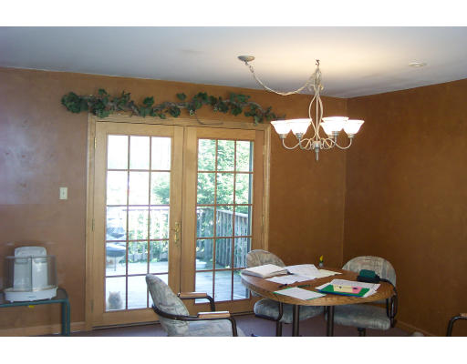 528 Cronin Road Warren, MA 01585 - Photo 9 of 13 a living room with furniture and a chandelier