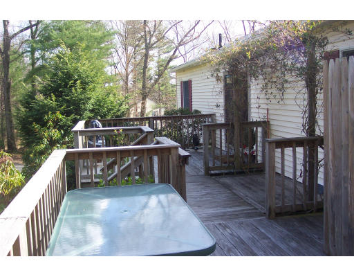 528 Cronin Road Warren, MA 01585 - Photo 10 of 13 a view of a balcony with chairs