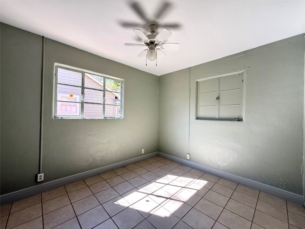 3702 Werner Avenue Austin, TX 78722 - Photo 14 of 20 an empty room with windows and fan