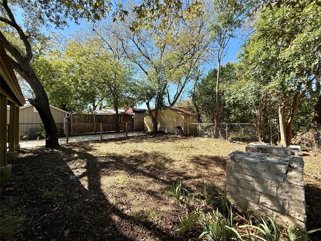 3702 Werner Avenue Austin, TX 78722 - Photo 16 of 20 a backyard of a house with parked trees