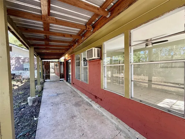 a view of a house with a snow in the yard