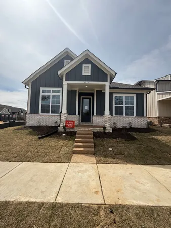 front view of a house with a rug
