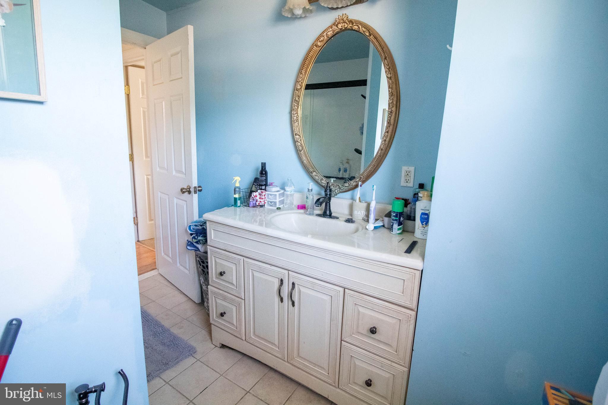 100 Grant Street Riverside, NJ 08075 - Photo 24 of 34 a bathroom with a sink and a mirror