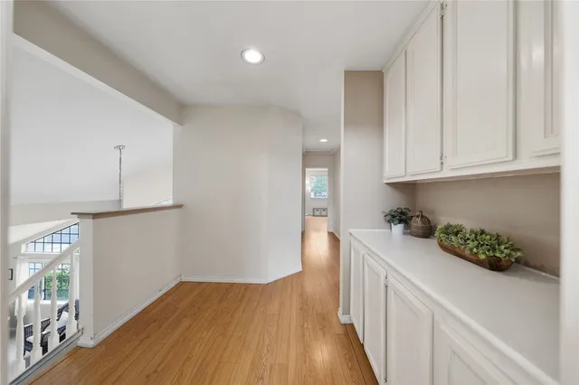 a bathroom with a double vanity sink toilet mirror and bathtub