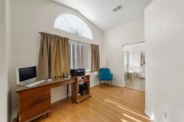 a bathroom with a bathtub sink and mirror