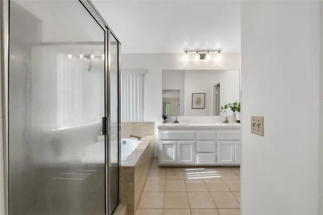 a bedroom with a bed and a mirror